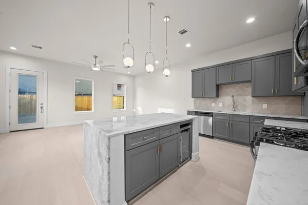 a kitchen with a sink and stove
