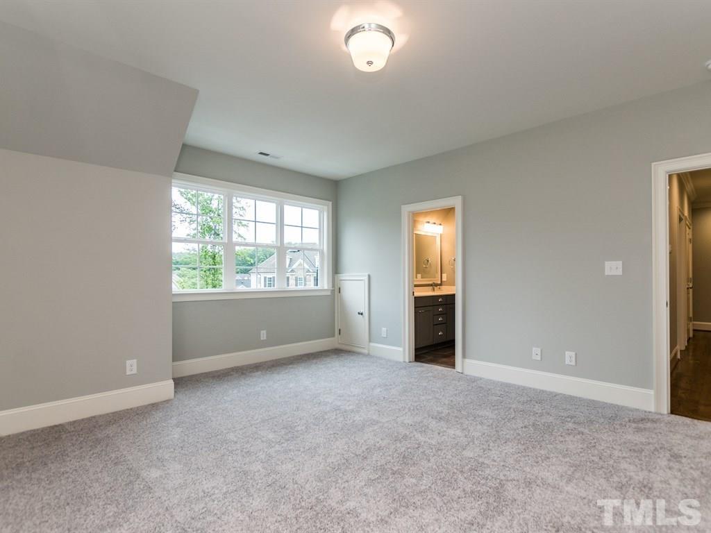 6407 Rosny Road Raleigh, NC 27613 - Photo 22 of 25 an empty room with windows and closet