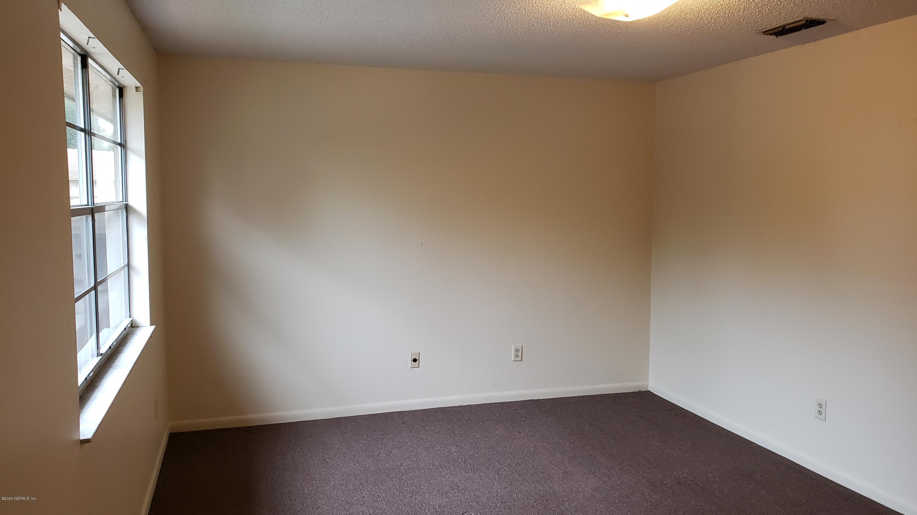 7208 Parker School Road, Unit 7 Jacksonville, FL 32211 - Photo 13 of 15 a view of an empty room with a window