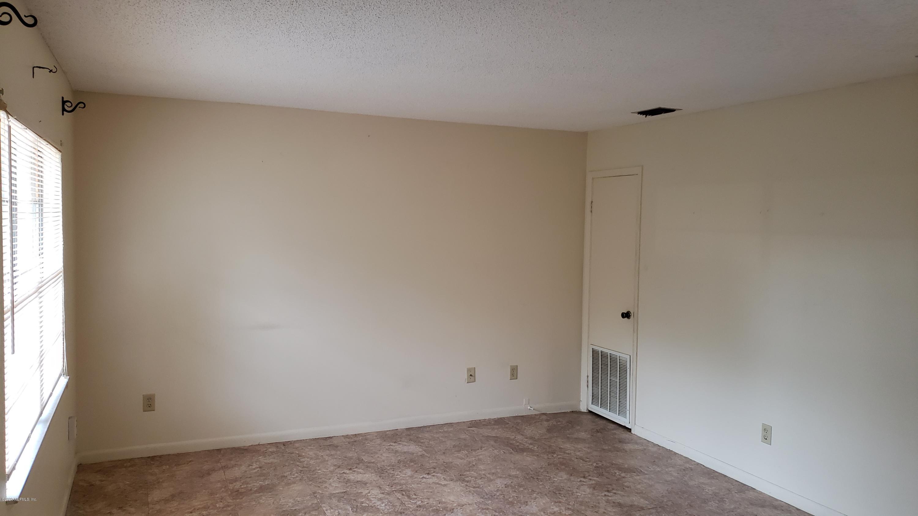 7208 Parker School Road, Unit 7 Jacksonville, FL 32211 - Photo 5 of 15 an empty room with a window