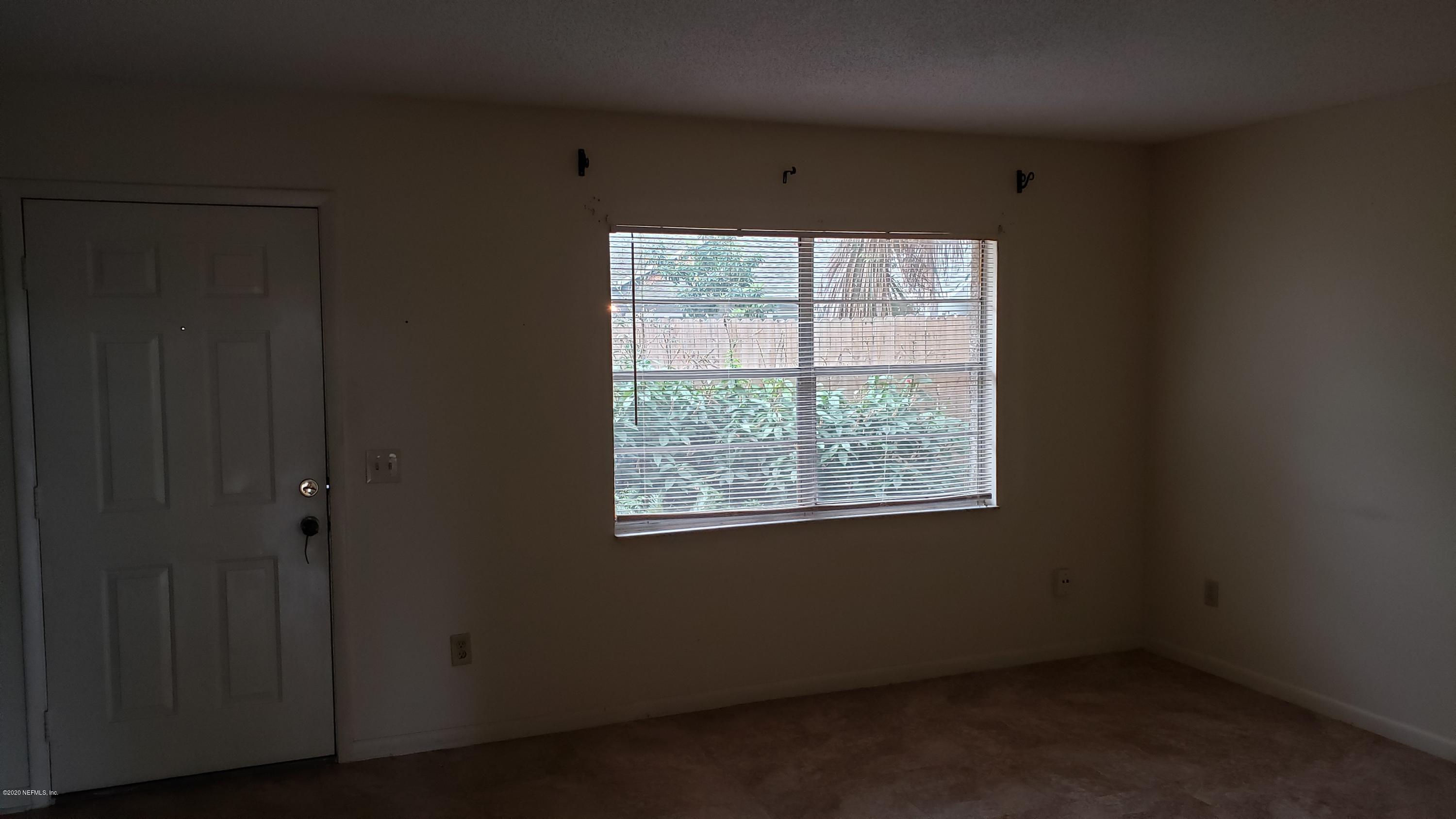 7208 Parker School Road, Unit 7 Jacksonville, FL 32211 - Photo 6 of 15 a view of an empty room with a window