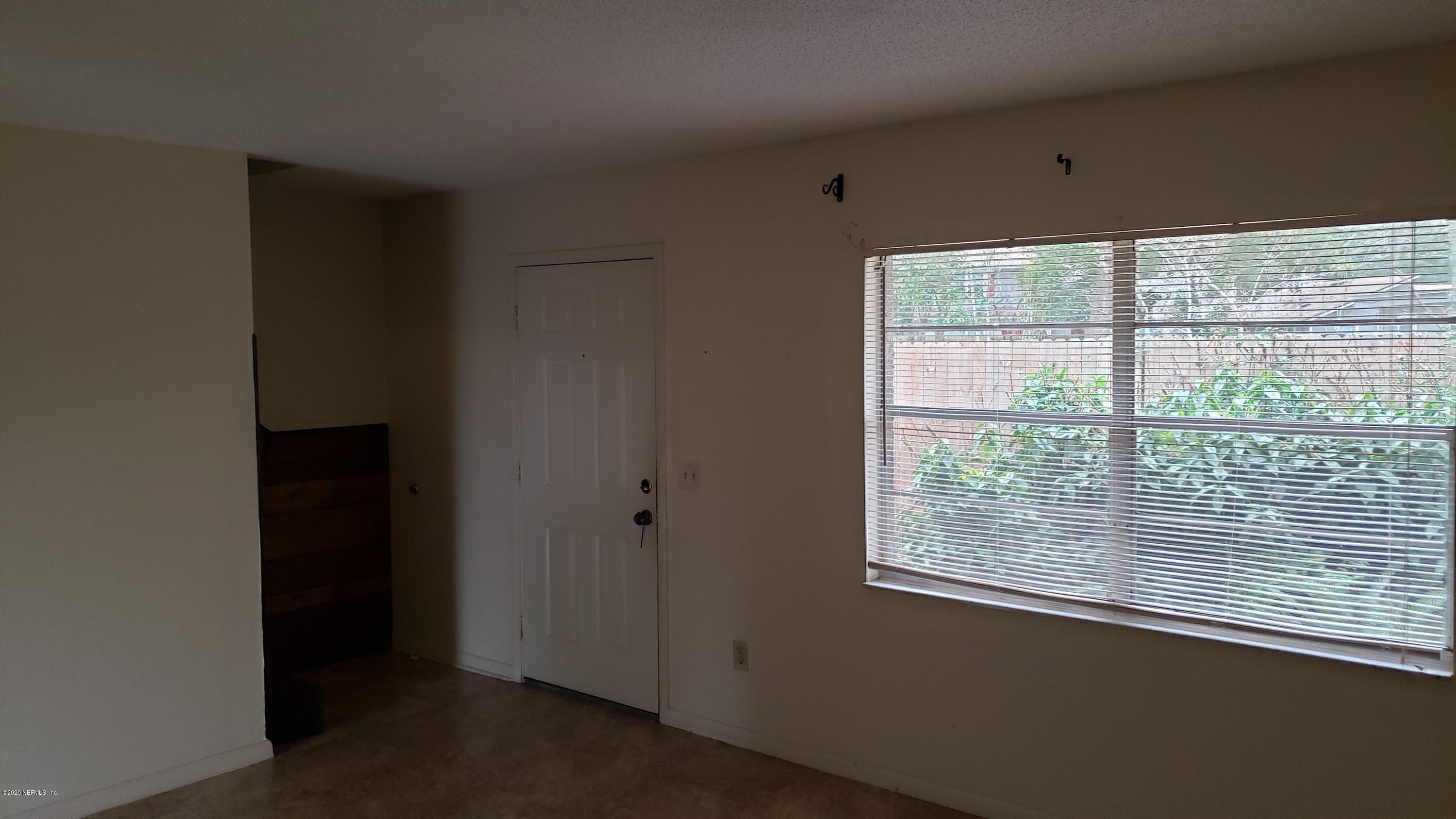 7208 Parker School Road, Unit 7 Jacksonville, FL 32211 - Photo 8 of 15 a view of a room that has a window in it