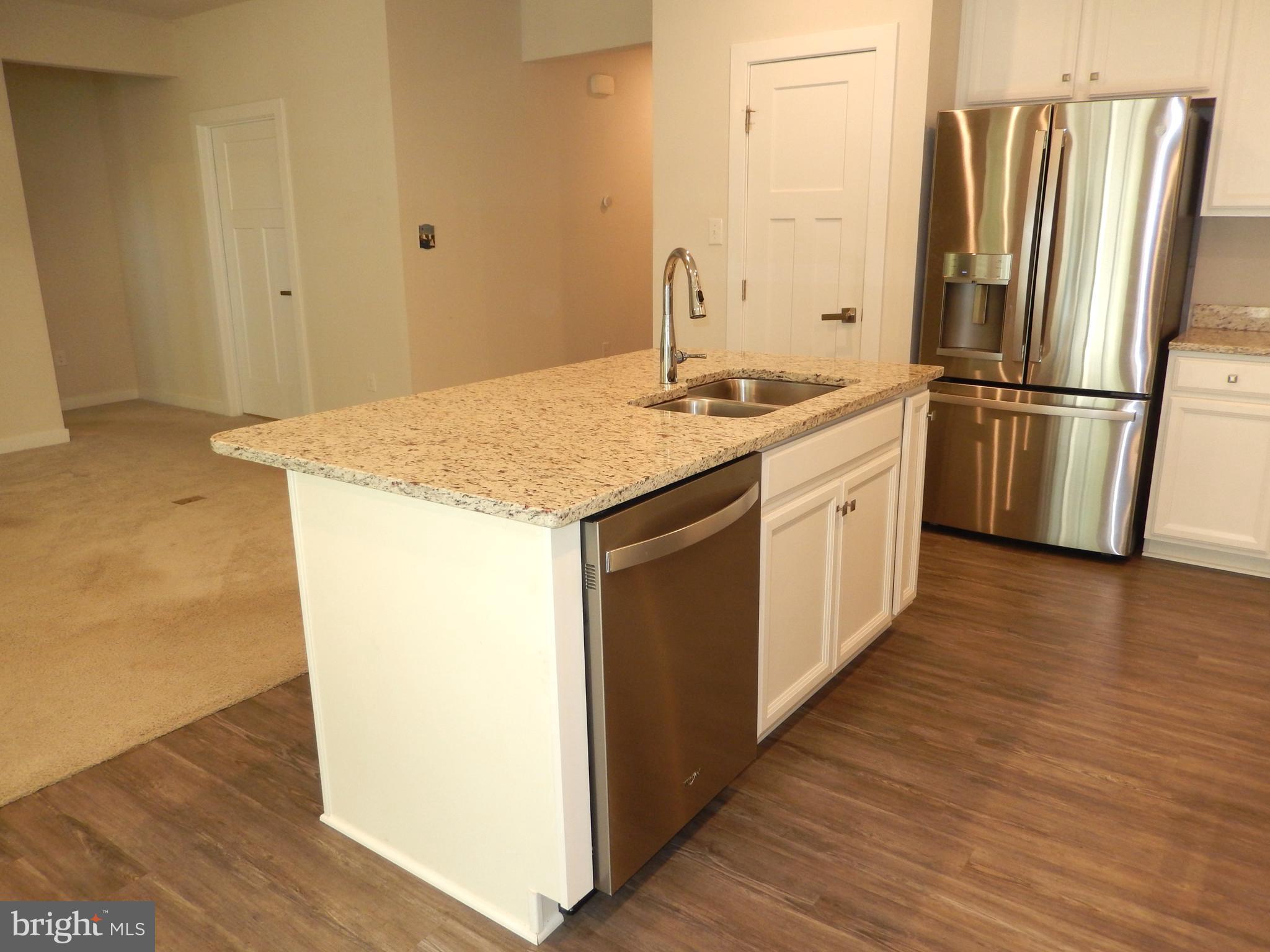 36884 Red Cedar Loop Ocean View, DE 19970 - Photo 12 of 50 a kitchen with stainless steel appliances granite countertop a refrigerator and a stove