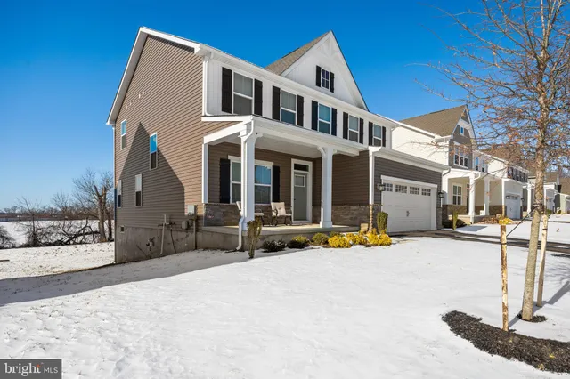 a view of a house with snow on the side of it