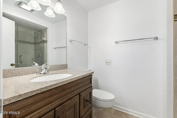 a bathroom with a glass shower door