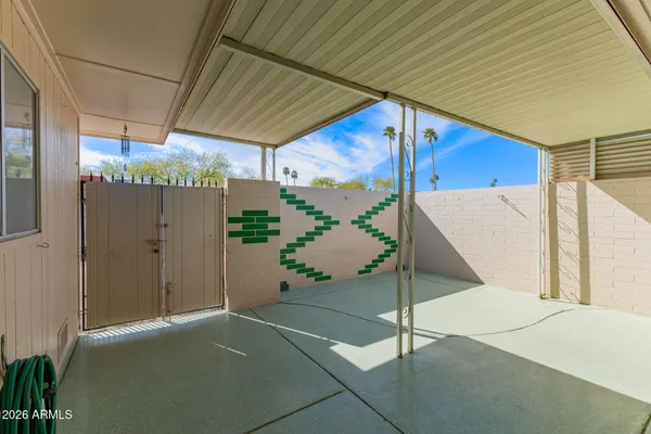 a view white cabinets and wooden floor