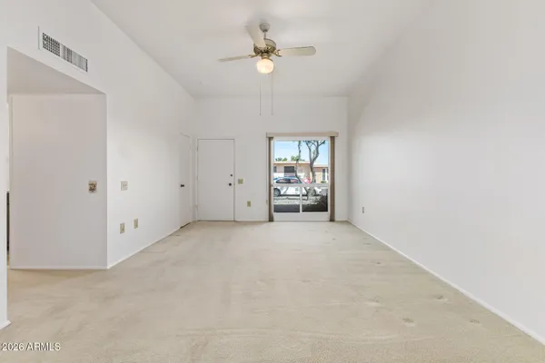 a view of an empty room with a window