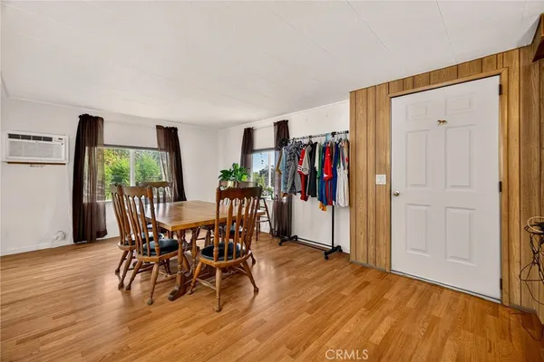a bedroom with a bed and a television
