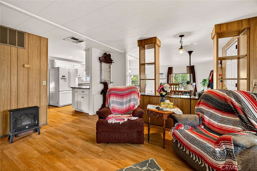 4783 County Orland, CA 95963 - Photo 19 of 73 a living room with furniture a fireplace and large windows