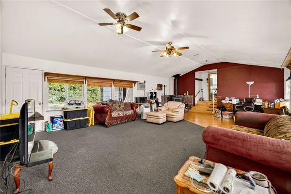 a living room with furniture a rug and a chandelier