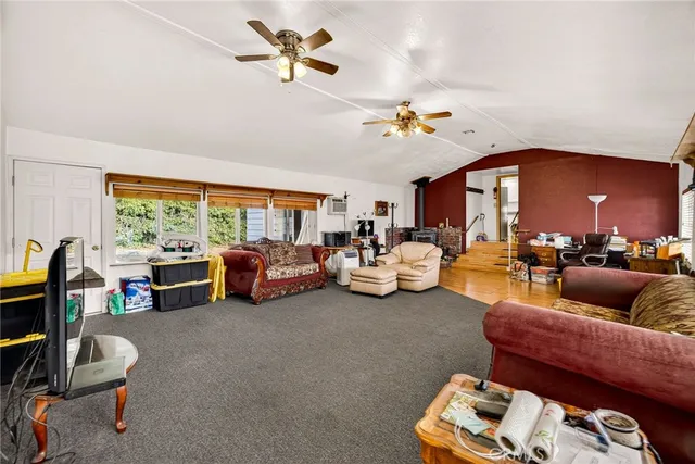 a living room with furniture a rug and a chandelier