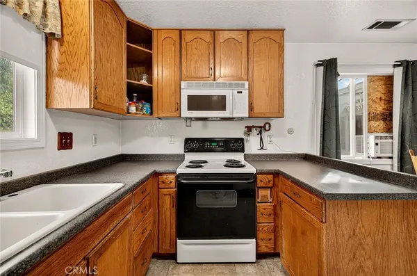 a view of storage and utility room with washer and dryer
