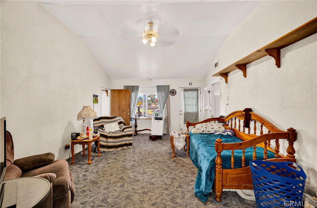 4783 County Orland, CA 95963 - Photo 37 of 73 a living room with furniture a rug and a chandelier