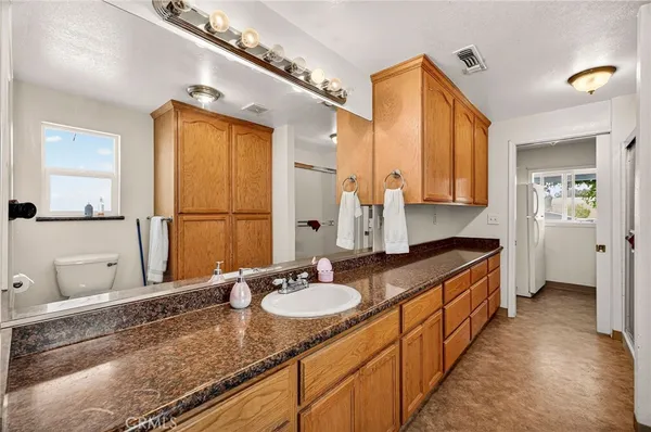 a bedroom with a bed and a mirror