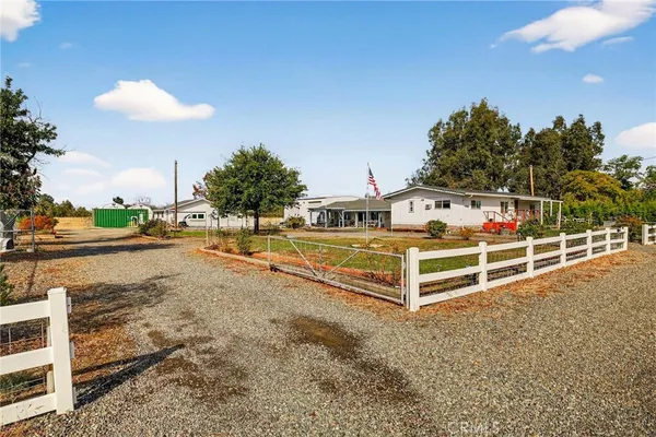 a large kitchen with stainless steel appliances granite countertop a large counter top and a stove