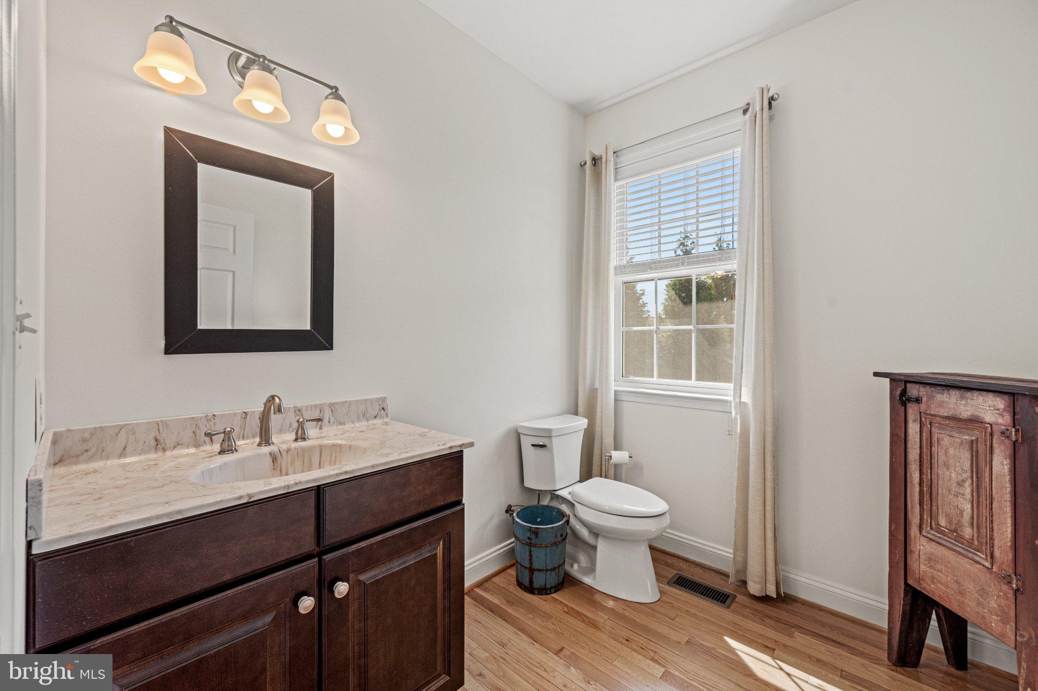 10693 Harding Road Laurel, MD 20723 - Photo 24 of 55 Bright and airy main level half bathroom retreat.