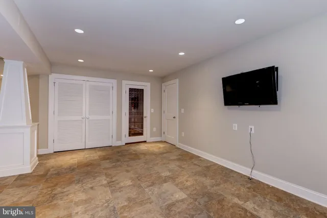 a view of an empty room with a flat screen tv