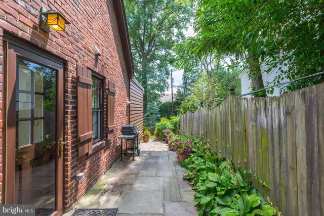a view of a backyard with sitting area