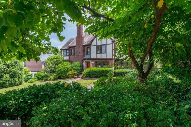 a aerial view of a house with balcony and garden