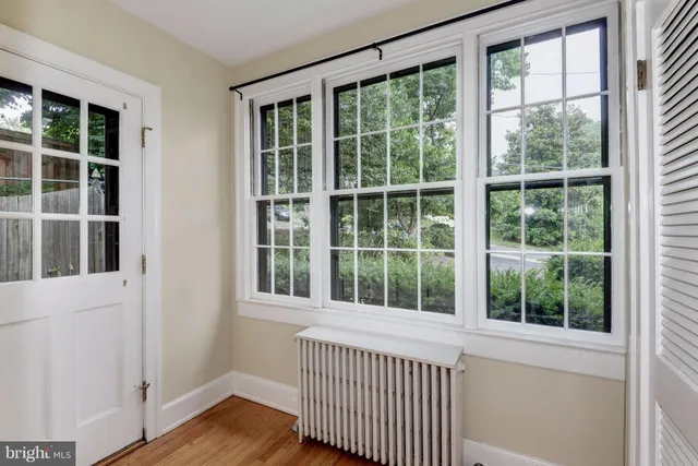 a view of a wooden floor and windows