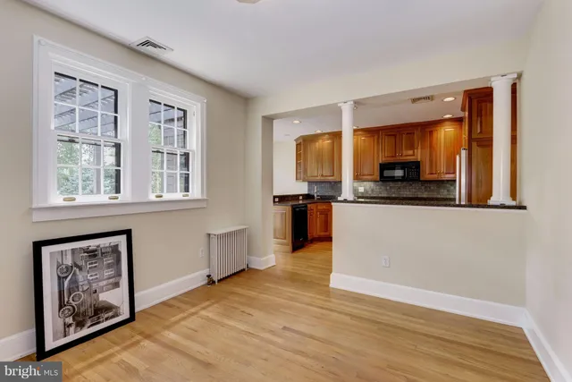 a view of a kitchen with a sink cabinets and a window