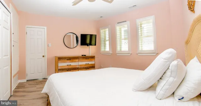 a bedroom with a bed and window