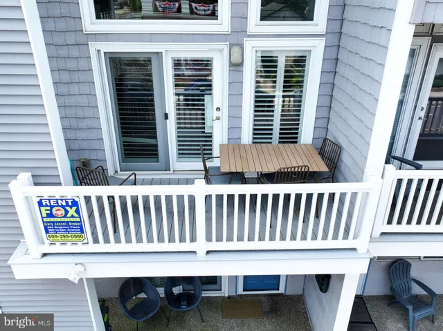 a view of a chair and table in the balcony