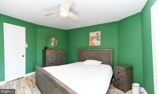 a bed room with a bed and a chandelier