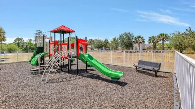 an outdoor sitting area with chairs and a table