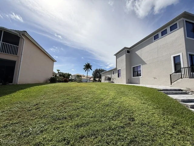 a view of a backyard of the house