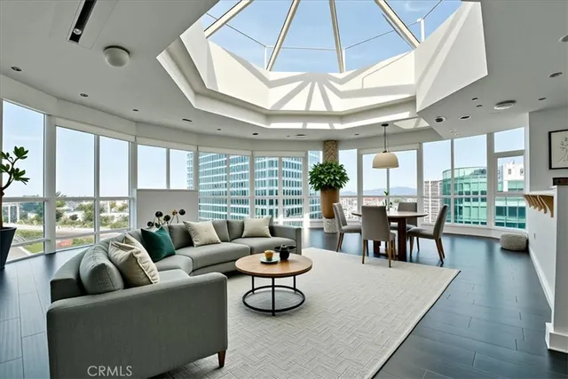 a living room with furniture a table and chairs