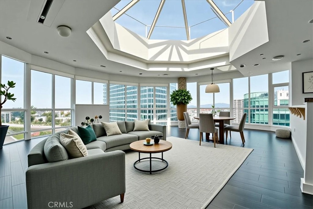 a living room with furniture a table and chairs