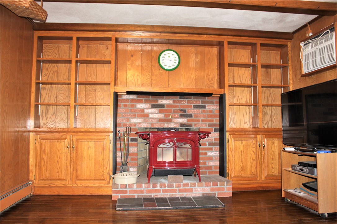 177 Scott Road Cumberland, RI 02864 - Photo 21 of 43 Den with wood Stove