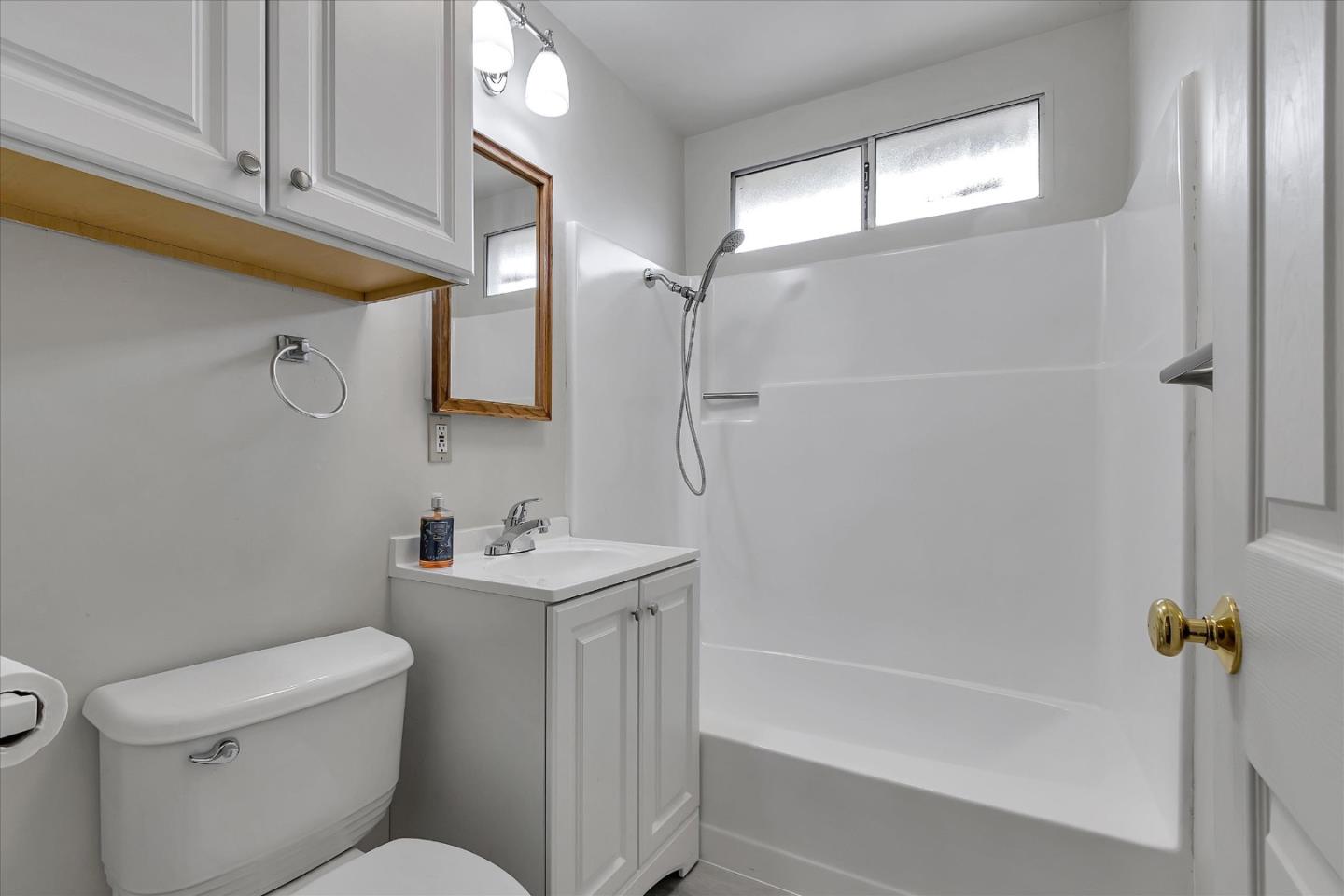 728 Arguello Boulevard Pacifica, CA 94044 - Photo 28 of 34 a bathroom with a sink toilet and shower