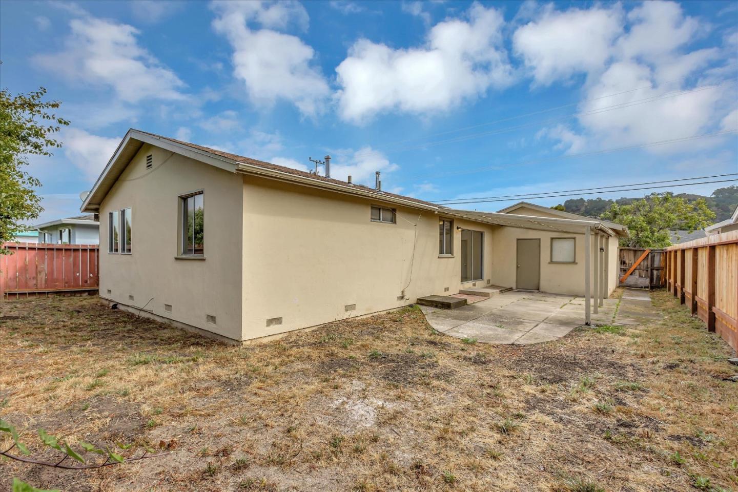 728 Arguello Boulevard Pacifica, CA 94044 - Photo 31 of 34 a view of a house with a wooden fence
