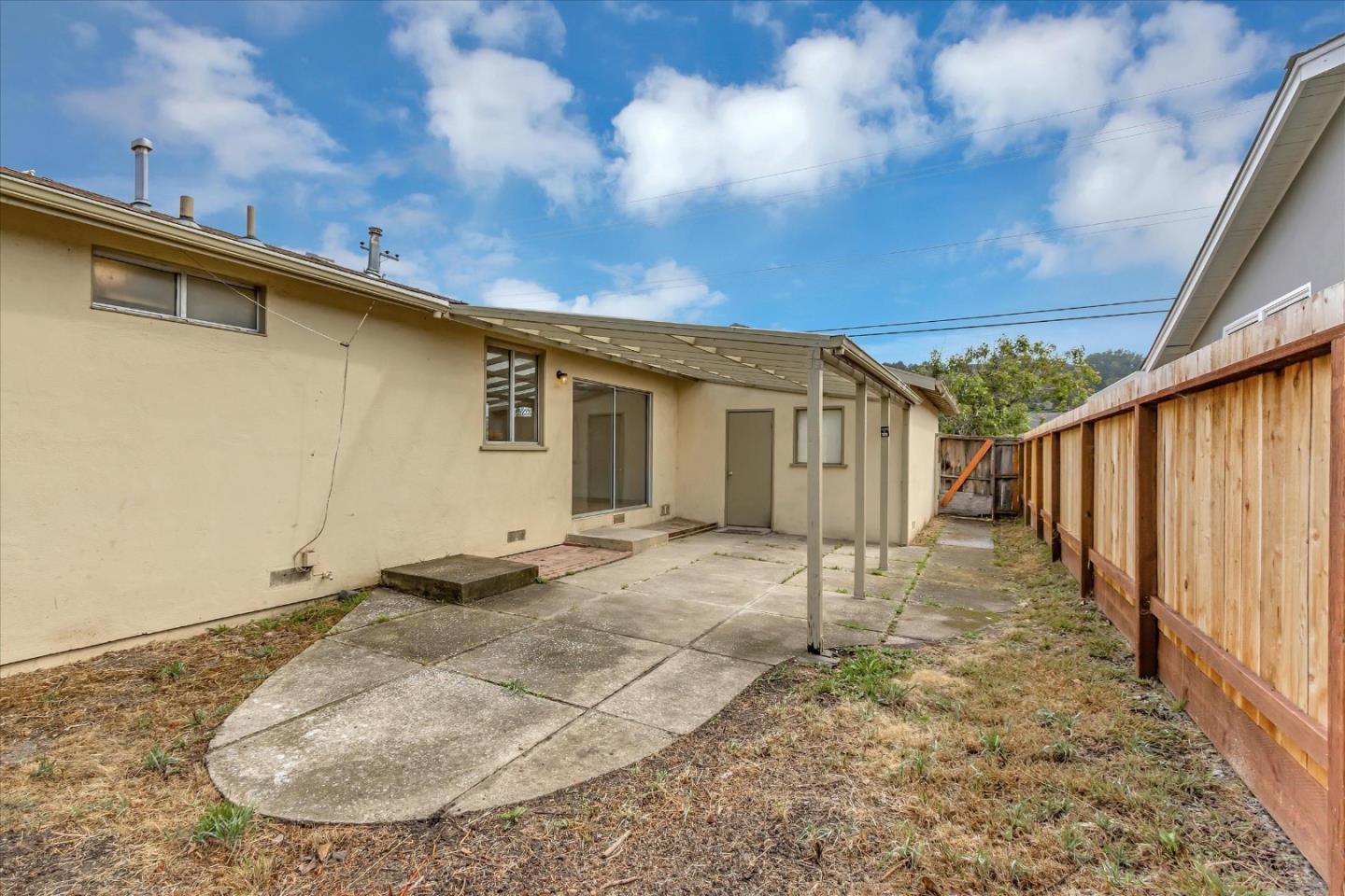 728 Arguello Boulevard Pacifica, CA 94044 - Photo 32 of 34 a view of a house with a backyard