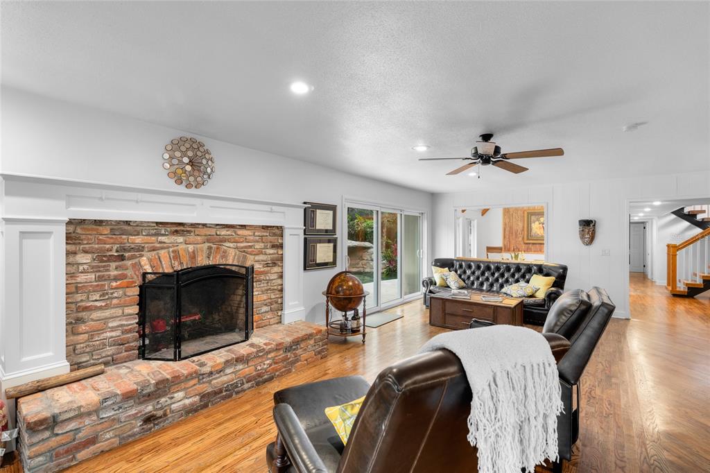 120 Beach Street Ponce Inlet, FL 32127 - Photo 13 of 91 a living room with furniture and a fireplace