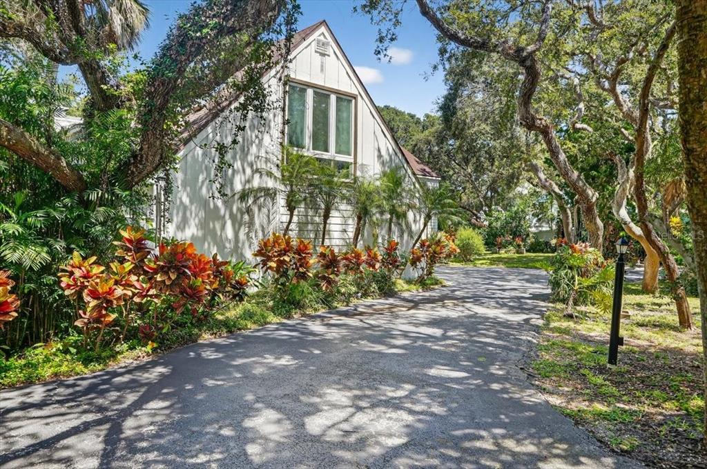 120 Beach Street Ponce Inlet, FL 32127 - Photo 2 of 91 a front view of a house with a yard and tree s