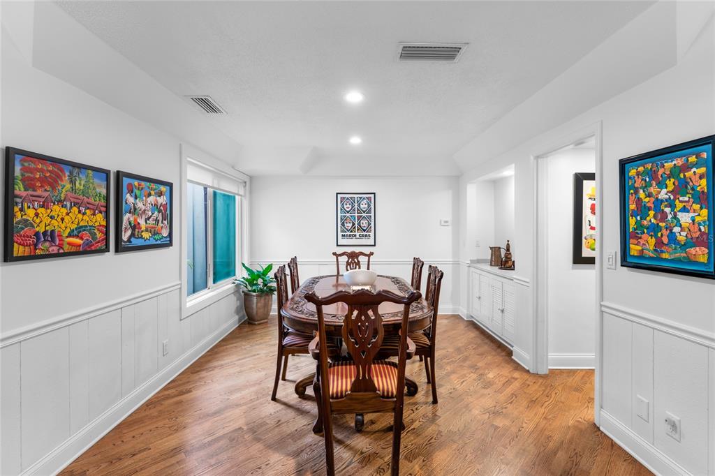 120 Beach Street Ponce Inlet, FL 32127 - Photo 24 of 91 a view of a dining room with furniture a rug and a window