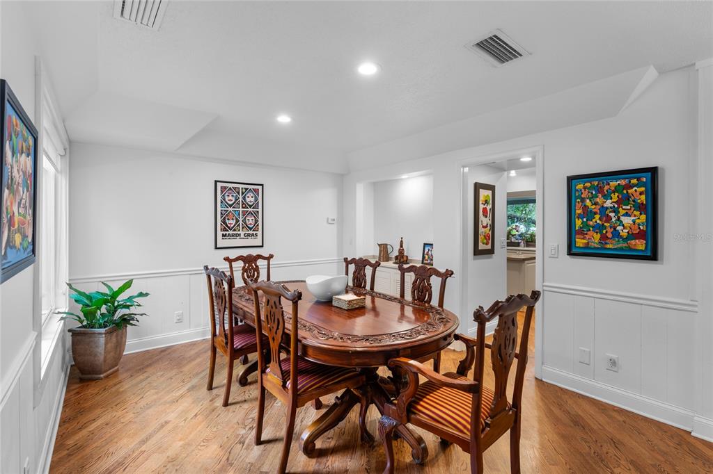 120 Beach Street Ponce Inlet, FL 32127 - Photo 25 of 91 a view of a dining room with furniture and wooden floor