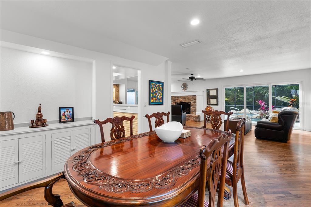120 Beach Street Ponce Inlet, FL 32127 - Photo 26 of 91 a dining room with furniture window and wooden floor