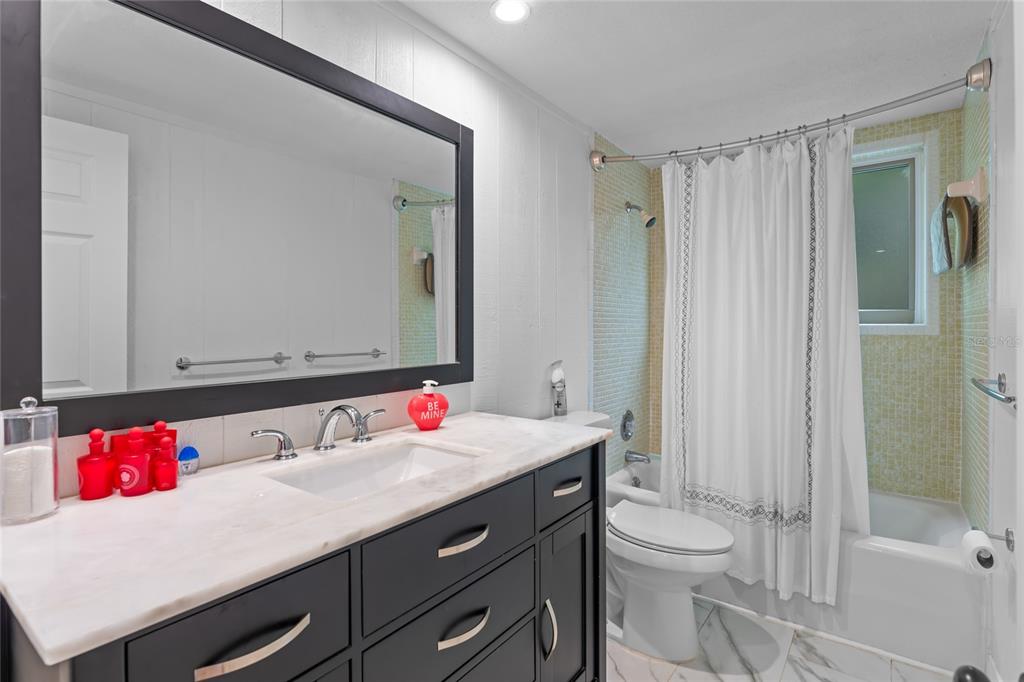 120 Beach Street Ponce Inlet, FL 32127 - Photo 28 of 91 a bathroom with a sink vanity mirror and toilet