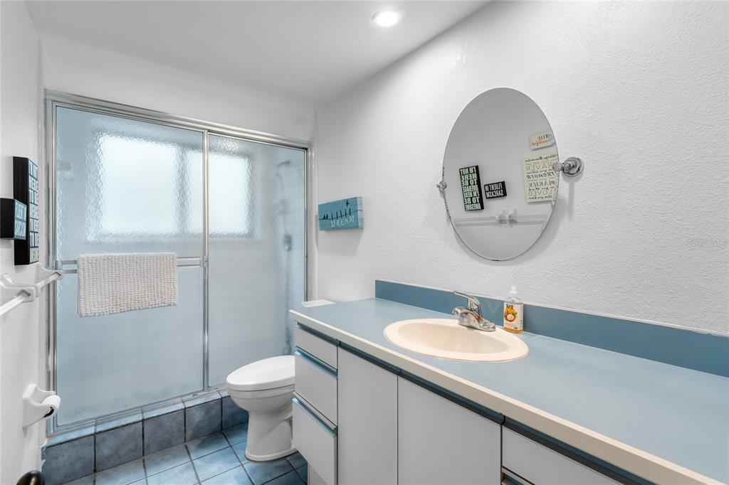 120 Beach Street Ponce Inlet, FL 32127 - Photo 30 of 91 a bathroom with a toilet a sink and mirror