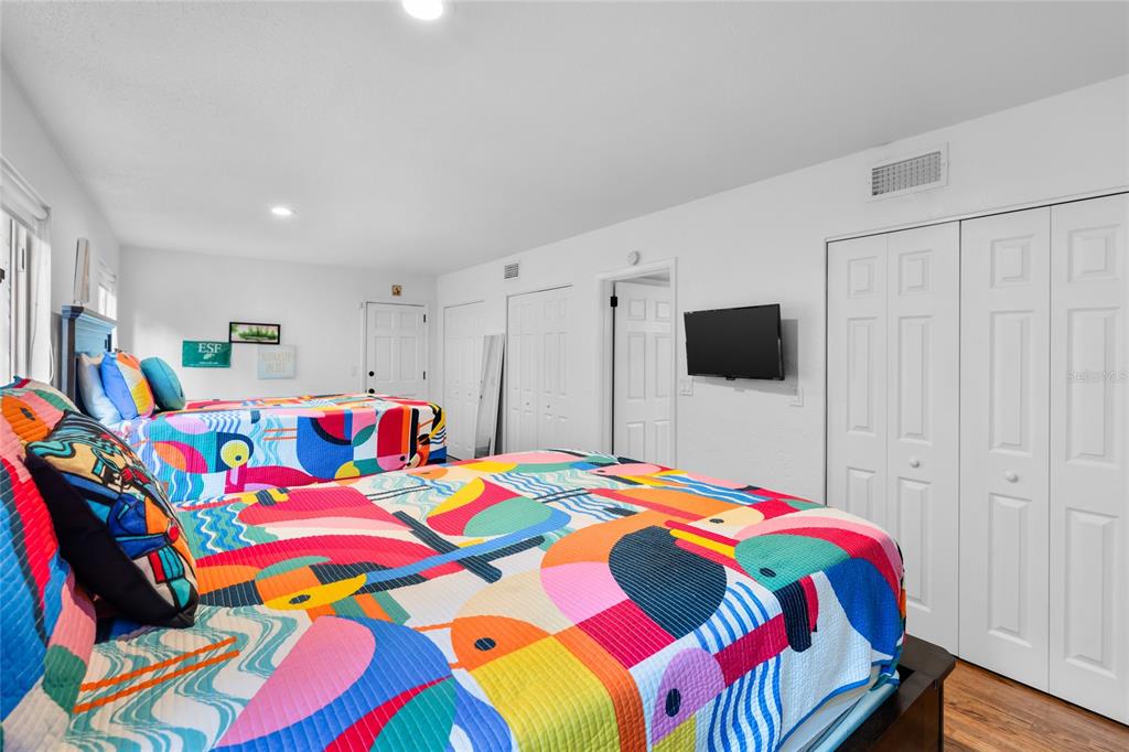120 Beach Street Ponce Inlet, FL 32127 - Photo 34 of 91 a room that has a bed and a tv in it