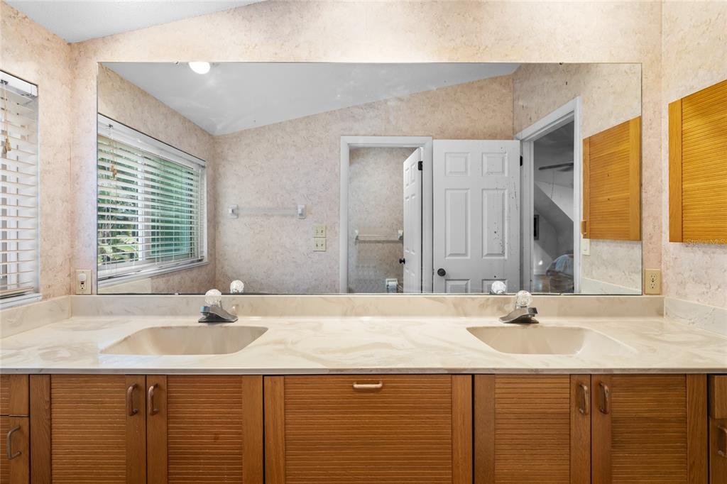 120 Beach Street Ponce Inlet, FL 32127 - Photo 37 of 91 a bathroom with a sink and a mirror