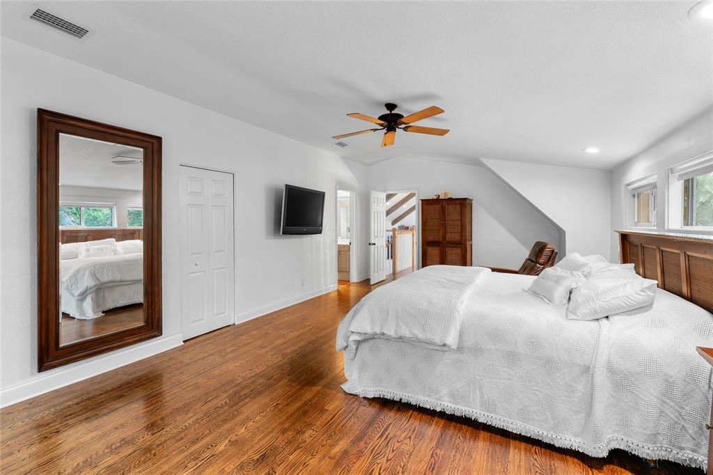 120 Beach Street Ponce Inlet, FL 32127 - Photo 42 of 91 a bedroom with a bed and a flat screen tv