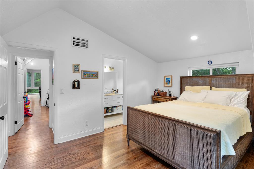 120 Beach Street Ponce Inlet, FL 32127 - Photo 46 of 91 a room with a bed and a view of kitchen
