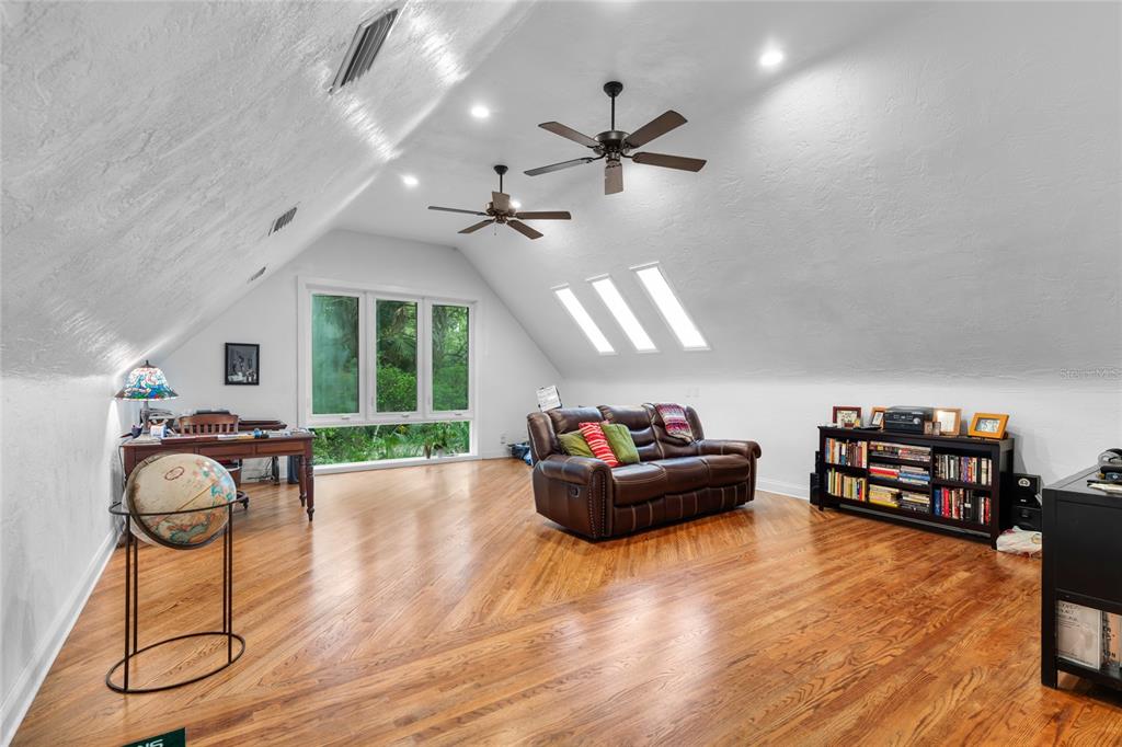 120 Beach Street Ponce Inlet, FL 32127 - Photo 50 of 91 a living room with fireplace furniture and a wooden floor
