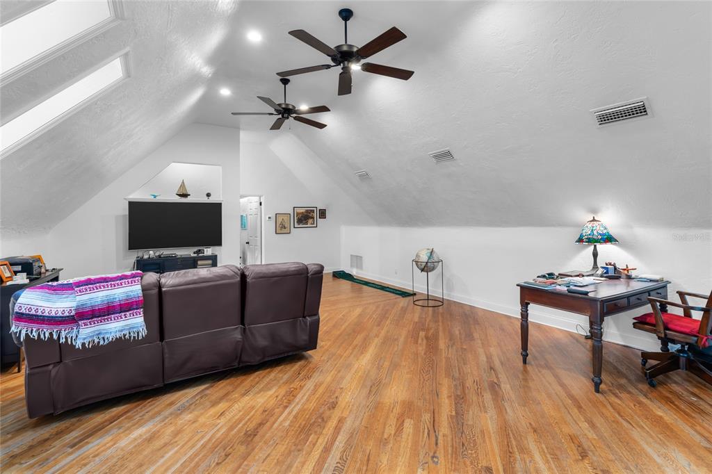 120 Beach Street Ponce Inlet, FL 32127 - Photo 52 of 91 a living room with furniture and a flat screen tv