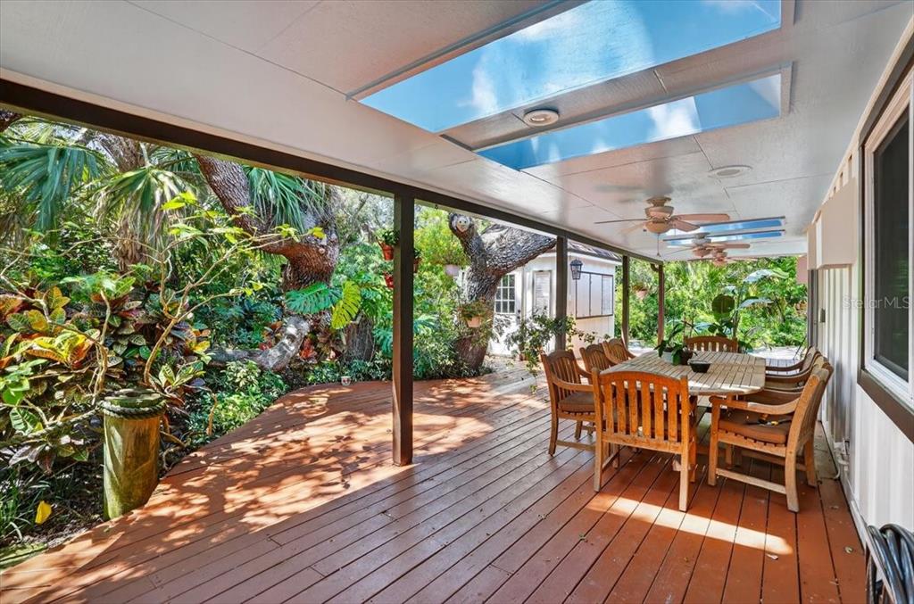 120 Beach Street Ponce Inlet, FL 32127 - Photo 74 of 91 a view of a patio with furniture and wooden floor